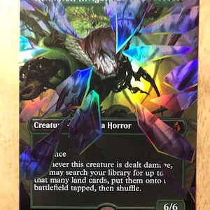 May include: A holographic trading card titled Hexhaven Invigorator, featuring a green creature illustration surrounded by floating, sharp, purple and blue crystalline shards. The card displays text, a 6/6 power and toughness, and a green mana symbol.