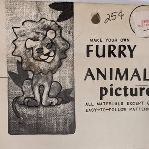May include: Vintage craft kit featuring a black and white illustration of a lion with a furry mane. The kit includes the text "MAKE YOUR OWN FURRY ANIMAL picture" and "ALL MATERIALS EXCEPT GLUE EASY-TO-FOLLOW PATTERNS". A price tag is visible.