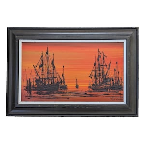 May include: An oil painting of a sunset scene featuring several sailboats. The boats are silhouetted against a vibrant orange and red sky. The painting is framed in a dark wooden frame.