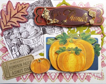 May include: A Thanksgiving card with a brown and gold banner that says "Give Thanks". The card also features a fall leaf, a basket of pumpkins, and a ticket that says "McCann's Pumpkin Patch Admit One".