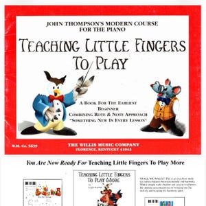 May include: A music instruction book titled John Thompson's Modern Course for the Piano: Teaching Little Fingers to Play. The cover features a white background with a red border, an owl in a blue coat, and a mouse in a yellow vest.
