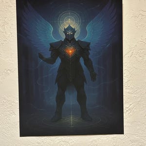 May include: A digital art print of a figure in dark armor with large blue wings. The figure has a heart-shaped design on the chest and a glowing halo. The background is a gradient of blues and dark colors.
