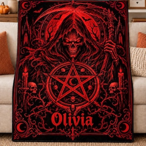 May include: A rectangular black and red throw blanket featuring a central grim reaper figure holding a scythe, a large pentagram, skulls, candles, and gothic architectural elements. The name Olivia is printed in a bold red gothic font at the bottom.