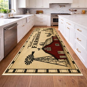 May include: A rectangular floor runner rug featuring a cream-colored background with a black border. The design includes a red barn, a black windmill, and a rooster illustration. The text Welcome to our FARMHOUSE is printed in black script.