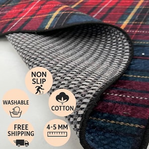 May include: A plaid blanket with red, blue, and yellow accents. The underside is a gray and white non-slip material. Features include washable cotton, and a thickness of 4-5 mm.