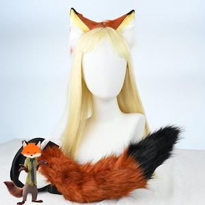 May include: A fox cosplay set comprising a headband with fox ears and a tail. The ears are brown, white, and yellow, and the tail is orange and black. The set is displayed on a mannequin with blonde hair, suitable for themed events.