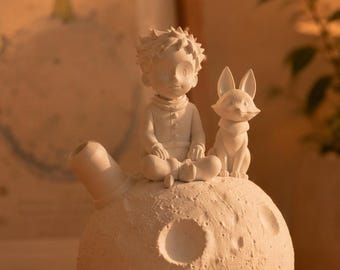 Figurine le petit prince sur lune