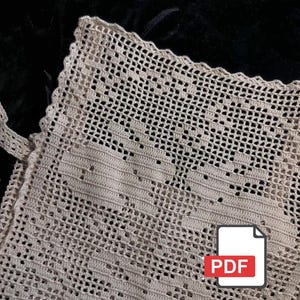 Peut inclure: Gros plan sur un article au crochet beige avec un motif ajour&eacute; d&eacute;licat. L'article a un bord festonn&eacute; et une sangle. L'image comprend une ic&ocirc;ne PDF dans le coin inf&eacute;rieur droit, sugg&eacute;rant un motif num&eacute;rique.