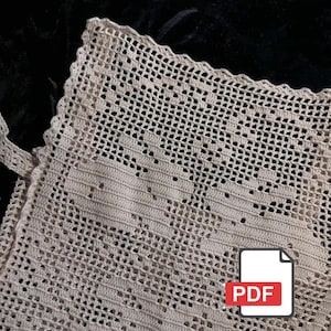 Peut inclure: Gros plan sur un article au crochet beige avec un motif ajour&eacute; d&eacute;licat. L'article a un bord festonn&eacute; et une sangle. L'image comprend une ic&ocirc;ne PDF dans le coin inf&eacute;rieur droit, sugg&eacute;rant un motif num&eacute;rique.