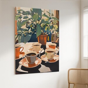 May include: A canvas print depicts a still life scene with coffee cups and a potted plant. The cups, in shades of orange and cream, sit on saucers. The plant has large green leaves. The background suggests a window with sunlight.