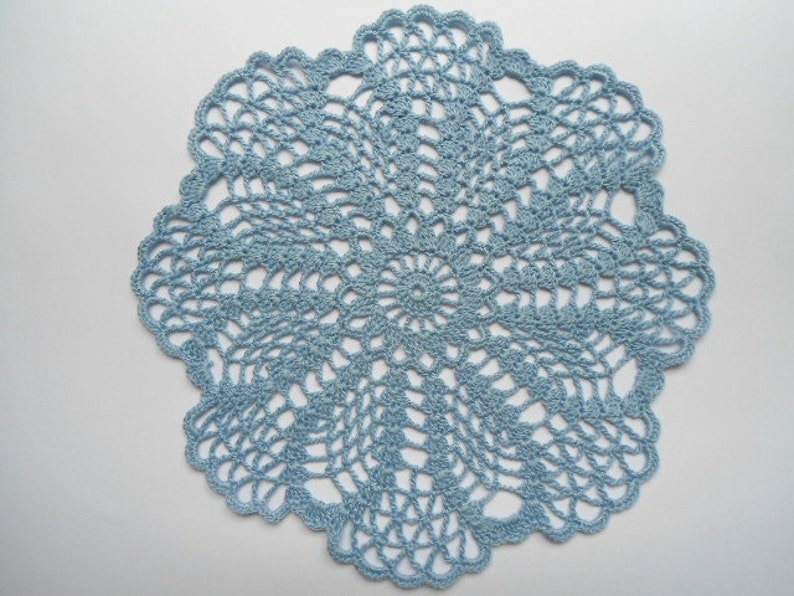Round crochet doily blue