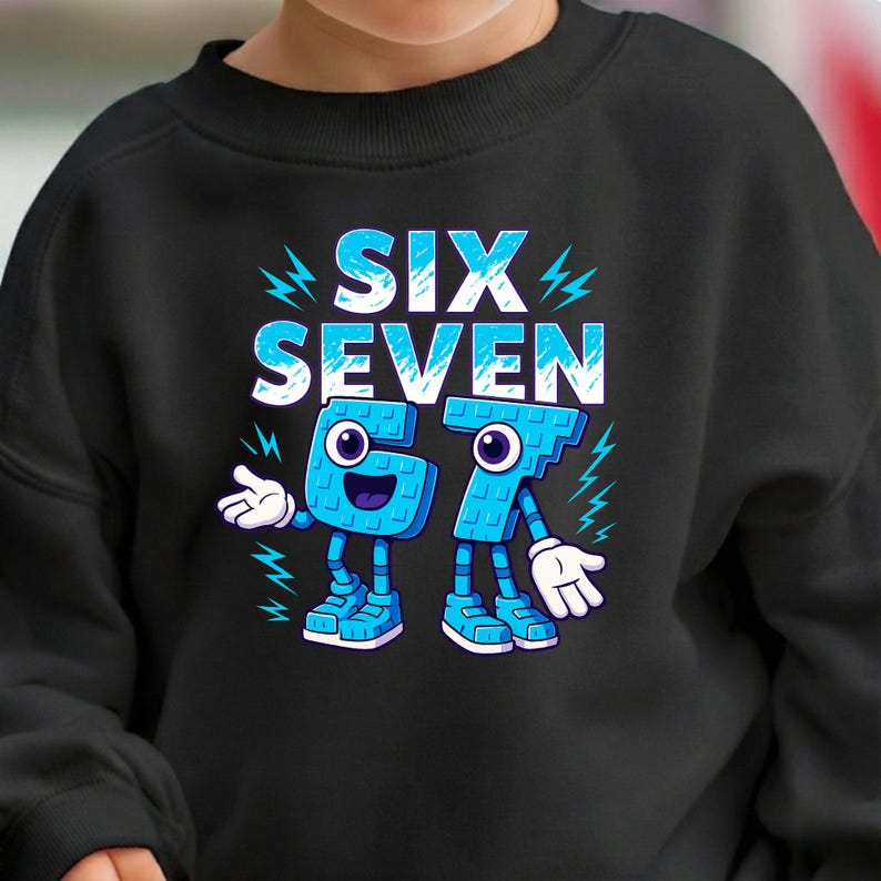 May include: Black sweatshirt featuring the words "SIX SEVEN" in white and blue, with lightning bolt accents. The numbers 6 and 7 are stylized as cartoon characters with arms, legs, and googly eyes. A fun, playful design.