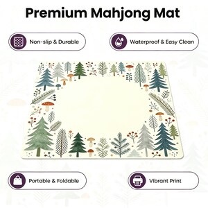 May include: A rectangular mahjong mat with a cream-colored center and a border of illustrated trees, mushrooms, and foliage. The mat is labeled "Premium Mahjong Mat" and features icons indicating it is non-slip, waterproof, portable, and has a vibrant print.