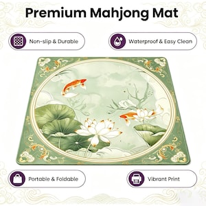 May include: A square green Mahjong mat featuring a central circular illustration of orange koi fish and white lotus flowers with green lily pads. The mat includes text labels for non-slip, durable, waterproof, easy clean, portable, foldable, and vibrant print.