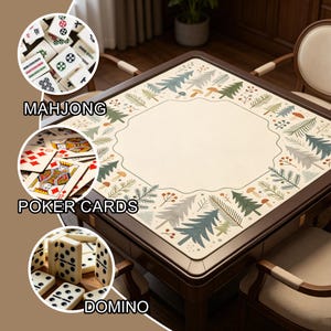 May include: A square, dark wood game table with a cream-colored surface featuring a forest-themed border. The image includes close-ups of Mahjong tiles, poker cards, and dominoes, with the text labels "MAHJONG", "POKER CARDS", and "DOMINO".