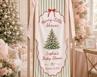 May include: A vertical fabric banner with green and white stripes, featuring a red scalloped border, a central Christmas tree illustration, and text reading Merry Little Shower, Sophia's Baby Shower, and December 14, 2026, with pink bows.