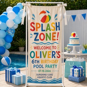May include: A vertical fabric banner on a white stand featuring a colorful beach ball graphic and the text SPLASH ZONE! WELCOME TO OLIVER'S 6TH BIRTHDAY POOL PARTY 07.18.2026 SUNSHINE COVE AQUATIC CLUB, decorated with white ribbons at the top corners.