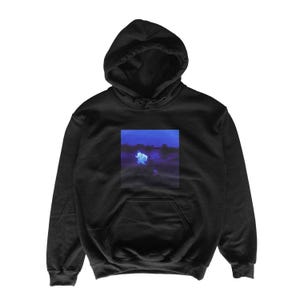 May include: Black hooded sweatshirt with a kangaroo pocket and drawstring hood. The front features a rectangular graphic with a blue and white image. The sweatshirt is made of a soft, comfortable material.