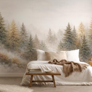 May include: A white ceramic mug with a black handle and the text "But First, Coffee" in a bold, black font. The mug is set against a blurred background, suggesting a cozy setting.