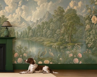 May include: A wall mural featuring a landscape with mountains, a lake, trees, and flowers, with a brown and white dog lying on the floor in front of a green fireplace mantel topped with a lamp featuring a patterned shade.