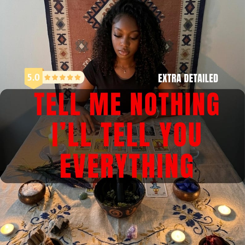 May include: A tarot card reading setup featuring a light-colored tablecloth with blue floral embroidery, a central dark bowl with herbs, small wooden bowls containing salt and blue stones, scattered crystals, lit candles, and a spread of tarot cards.