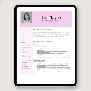 May include: A digital tablet showing a resume template. The resume includes a photo, name, and sections for professional summary, core skills, and professional experience. The design uses a pink header and is set against a light background.