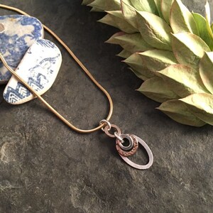 Mixed metal oval pendant ~ silver and gold ~ sterling silver bronze gold fill ~ circles and ovals ~ short rolo chain