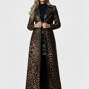 May include: A long, leopard-print coat with a black collar and trim. The coat is floor-length and has a classic trench coat design. The coat is made of a faux leather material and is a statement piece.