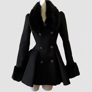 May include: A black double-breasted coat with a faux fur collar and cuffs. The coat features decorative buttons and a flared skirt, creating a classic and elegant silhouette. The coat is displayed on a mannequin.