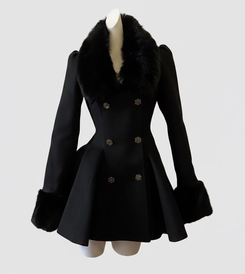 May include: A black double-breasted coat with a faux fur collar and cuffs. The coat features decorative buttons and a flared skirt, creating a classic and elegant silhouette. The coat is displayed on a mannequin.