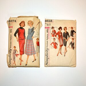 May include: Two vintage Simplicity sewing patterns. The pattern on the left is number 2274 and is for a dress. The pattern on the right is number 5618 and is for a dress with a scarf. Both patterns feature illustrations of women wearing the dresses.