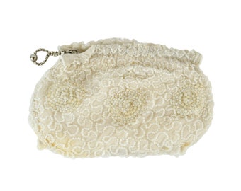 May include: A white beaded evening bag with a silver chain and clasp.