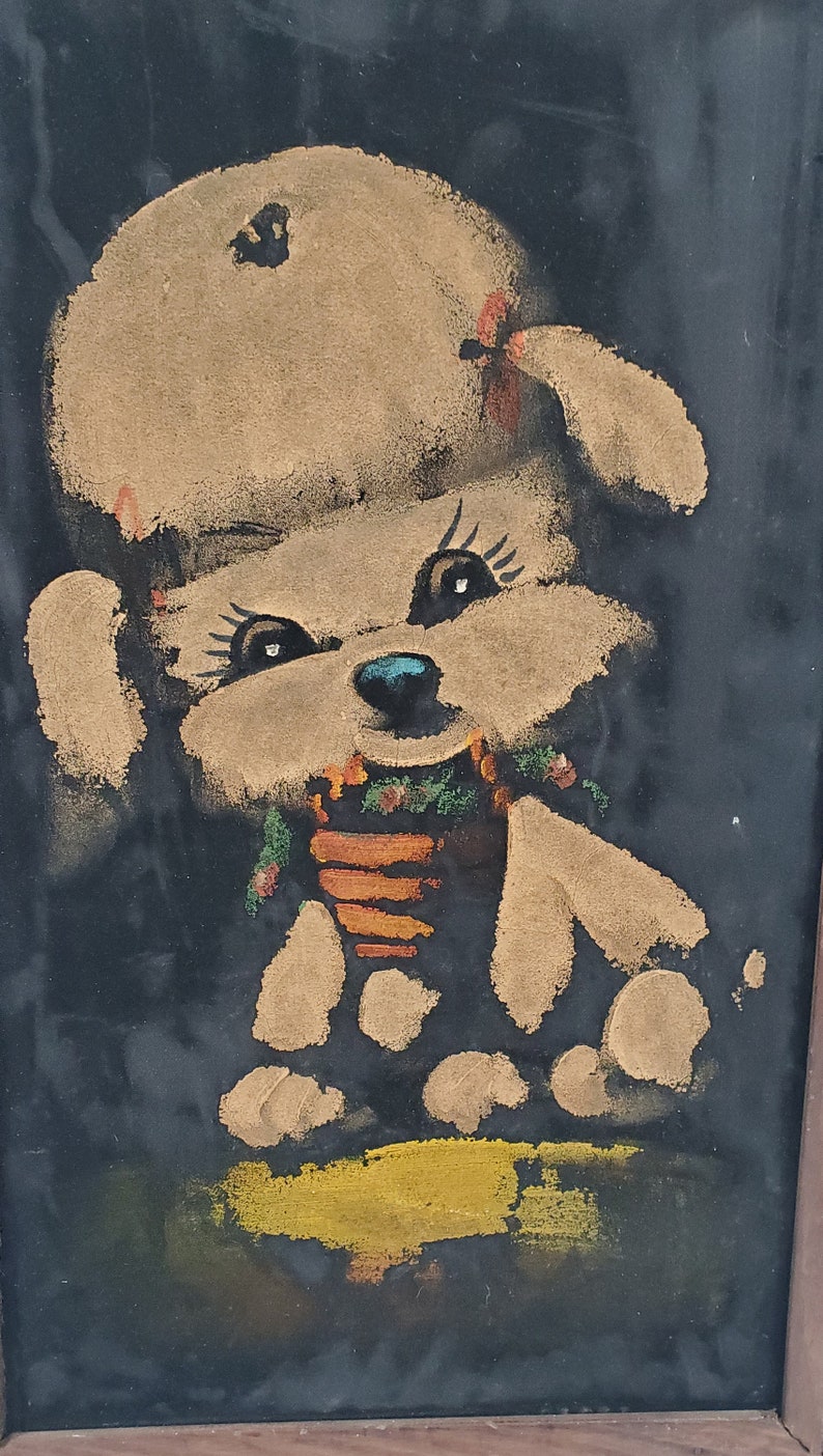 May include: A painting of a white dog wearing a brown hat and a green and orange scarf. The dog is sitting on a yellow surface against a black background.