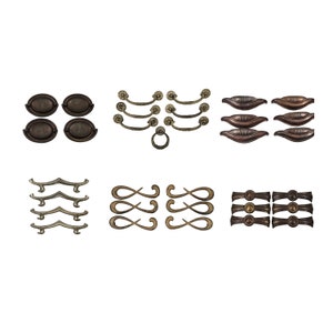 May include: Assortment of antique-style cabinet hardware, including pulls, knobs, and drawer pulls in various shapes and finishes. The hardware is made of metal and has a distressed look.