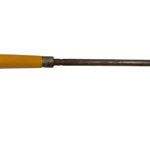 May include: A yellow handled metal sharpening steel for knives.