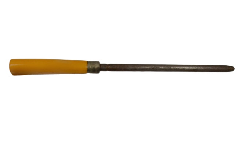 May include: A yellow handled metal sharpening steel for knives.
