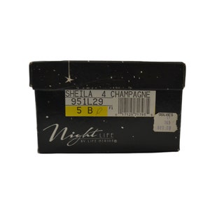 May include: Black shoebox with a star pattern and the text "Night Life by Life Stride" on the front. The box has a yellow label with the text "SHEILA 4 CHAMPAGNE 951L29 5 B F1 0 17125 71793 5 OGILVIE'S 17 753 #49.00".