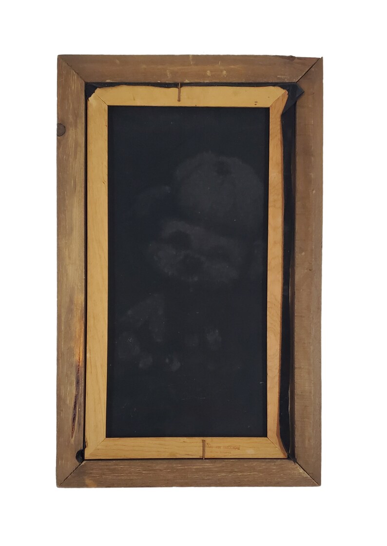 May include: A wooden picture frame with a black background. The frame is brown with a lighter wood trim.