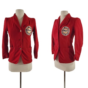 May include: Red blazer with a circular embroidered patch that reads "All Ohio Youth Choir, Ohio USA".