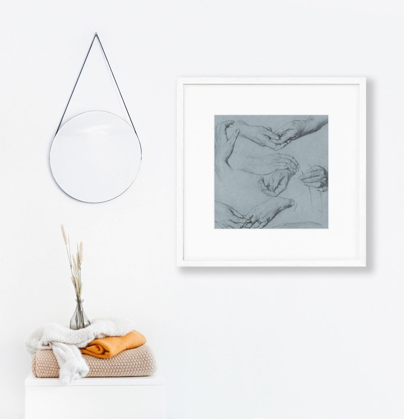 May include: A framed black and white drawing of several hands in various poses. The hands are drawn on a light blue background.