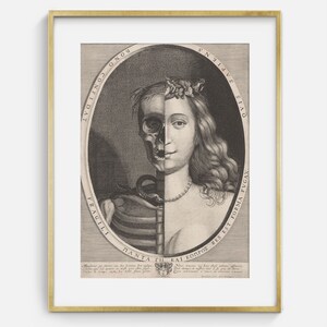 May include: An antique black and white print in a gold frame. The artwork depicts a woman's face split in half, with one side showing a skull and the other a living face. The image is surrounded by text.