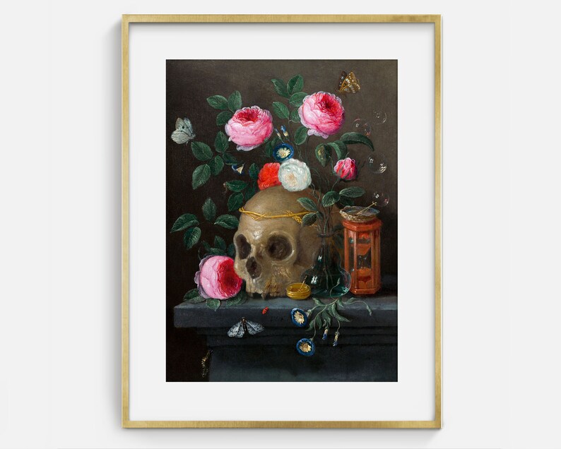 May include: A still life painting featuring a human skull with a gold band around it, surrounded by pink and white roses, a small glass bottle, and a red and gold box. The painting is set against a dark brown background.