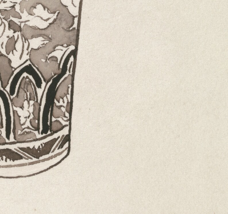 May include: Close-up of a brown and black ceramic vase with a floral design. The vase has a rounded bottom and a wide mouth.
