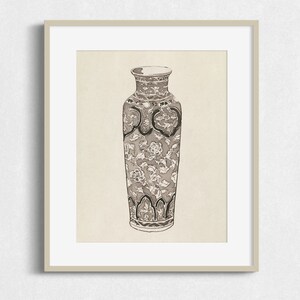 May include: A black and white illustration of a decorative vase with a floral pattern.