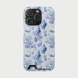 May include: A light blue phone case featuring a repeating pattern of detailed blue seashells, coral, and other marine elements. The case has a glossy finish and a camera cutout at the top.