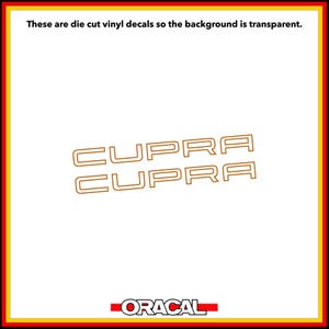 Könnte beinhalten: Zwei gestanzte Vinyl-Aufkleber mit dem Wort CUPRA in einer goldfarbenen Umriss-Schriftart. Der Text "These are die cut vinyl decals so the background is transparent" steht oben und das Wort "ORACAL" ist unten aufgedruckt.