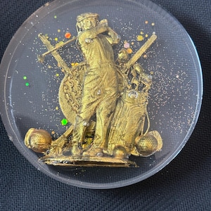 ゴルファーが乗ったゴルフコースター