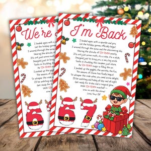 May include: Two Christmas-themed cards with red and white striped borders. One card reads "We're" and the other "I'm Back." Both cards feature festive illustrations, including gingerbread men, candy canes, and a cartoon elf.