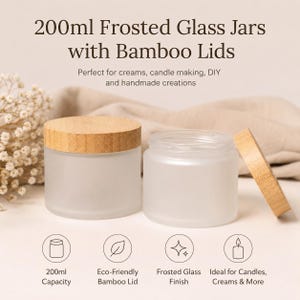 May include: Two frosted glass jars with bamboo lids. The jars have a capacity of 200ml. One jar is closed, the other is open. The image includes text: "200ml Frosted Glass Jars with Bamboo Lids".