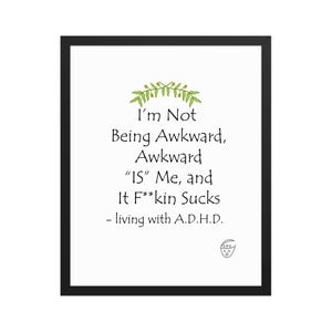 Puede incluir: Un marco negro muestra el texto "I'm Not Being Awkward, Awkward 'IS' Me, and It F**kin Sucks - living with A.D.H.D." en negro. Un diseño de hojas verdes adorna la parte superior y un pequeño logotipo en la parte inferior.